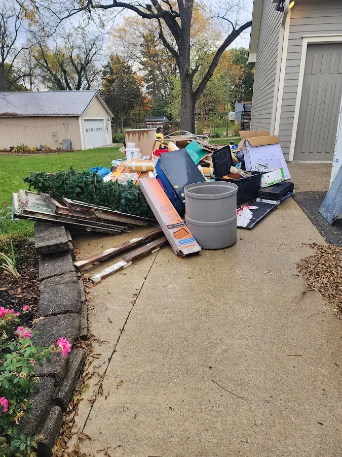 Dumpster being loaded with debris for 30 Yard Dumpster Rental in Conway